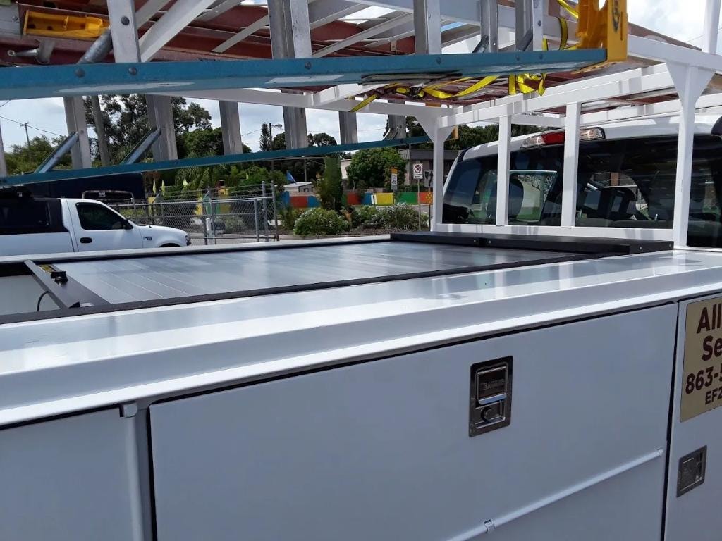 Rollcover utility bed cover installed on service truck at facility